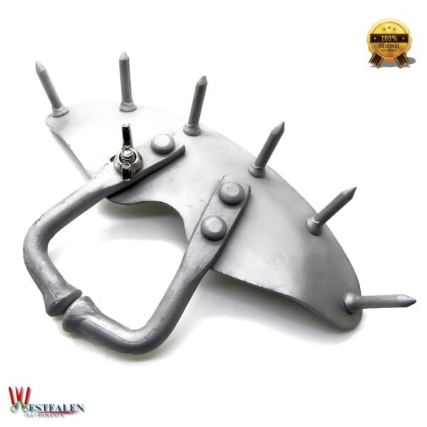 Metal calf nose ring with spikes designed to prevent milk sucking and assist in weaning young cattle, from Westfaleninstrumente