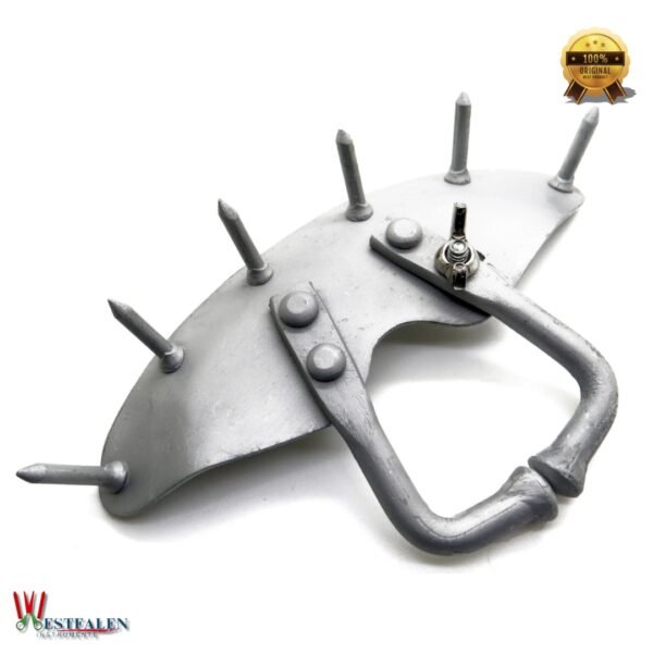 Metal calf nose ring with spikes designed to prevent milk sucking and assist in weaning young cattle, from Westfaleninstrumente